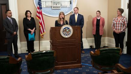 Megan Kaun, Director of Sonoma Safe Ag Safe Schools, at podium, speaking