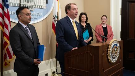 Asm. Connolly at podium, speaking